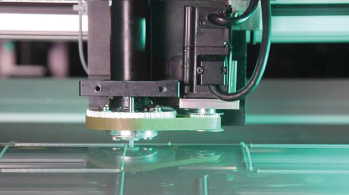 Figure 8.11 - Laying down Dart polymer rules on to a foil mounted on the creasing cylinder, instantly forming highquality creasing rules within a matter of minutes without any need for traditional dies