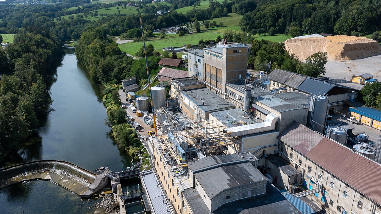 Aerial view of Mondi Neusiedler paper mills next to a river