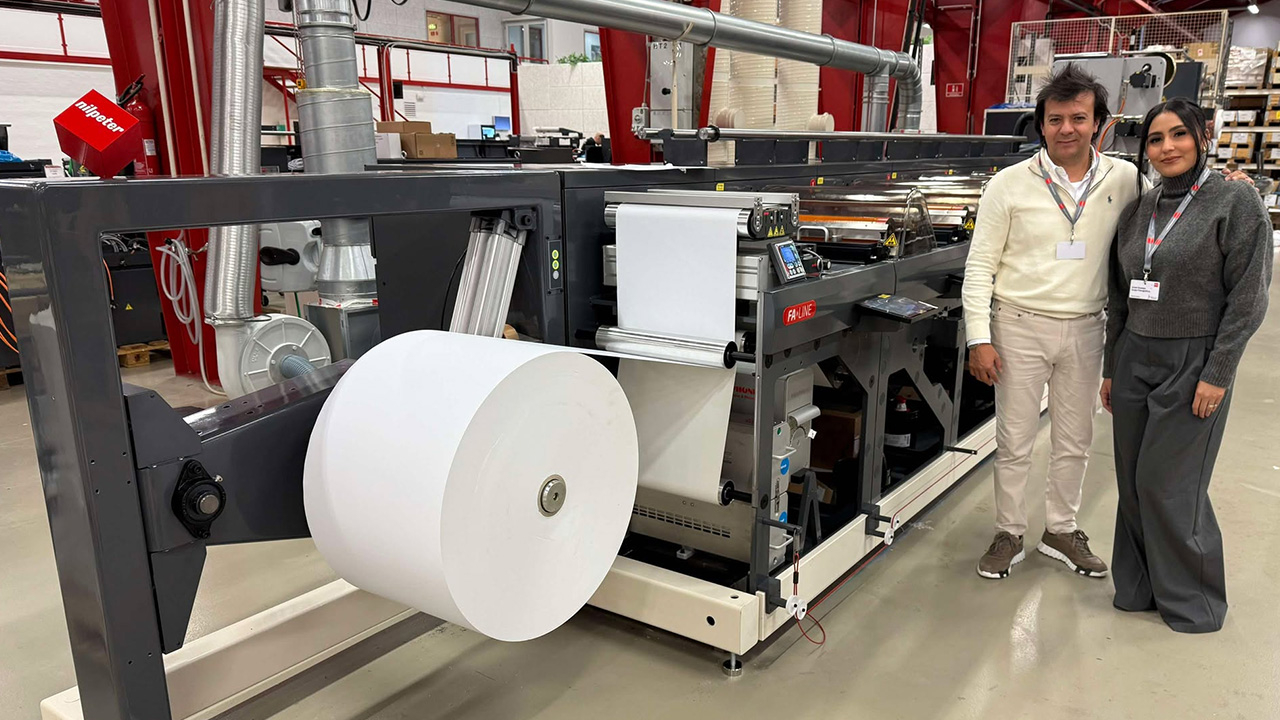 Juan Carlos Ocampo and Grisel stand in front of the new FA-Line