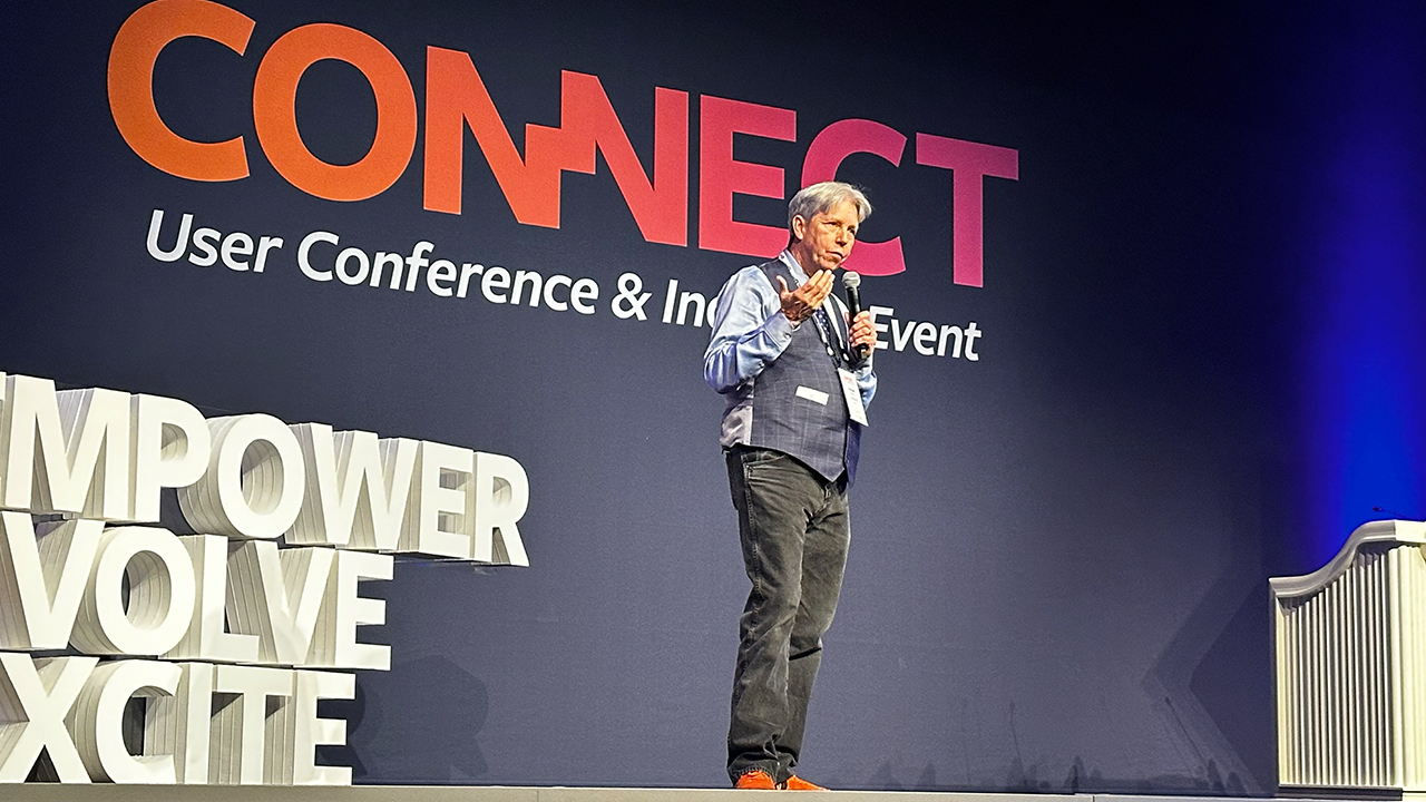 Doug Braun speaking on stage