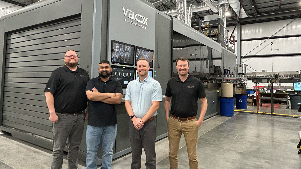L-R: Joe Schorr, director of operations; Gopi Vemavaram, head of direct-to-object operations; Andrew Boyd, president; and Gareth Boyd, director of finance, in front of the Velox machine