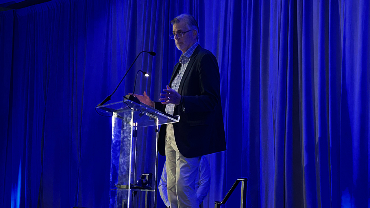 Mark Glendenning speaks at a podium