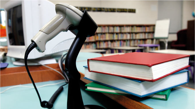 Figure 1.4 - Barcodes and scanners are used in libraries to check books out and back in on their return