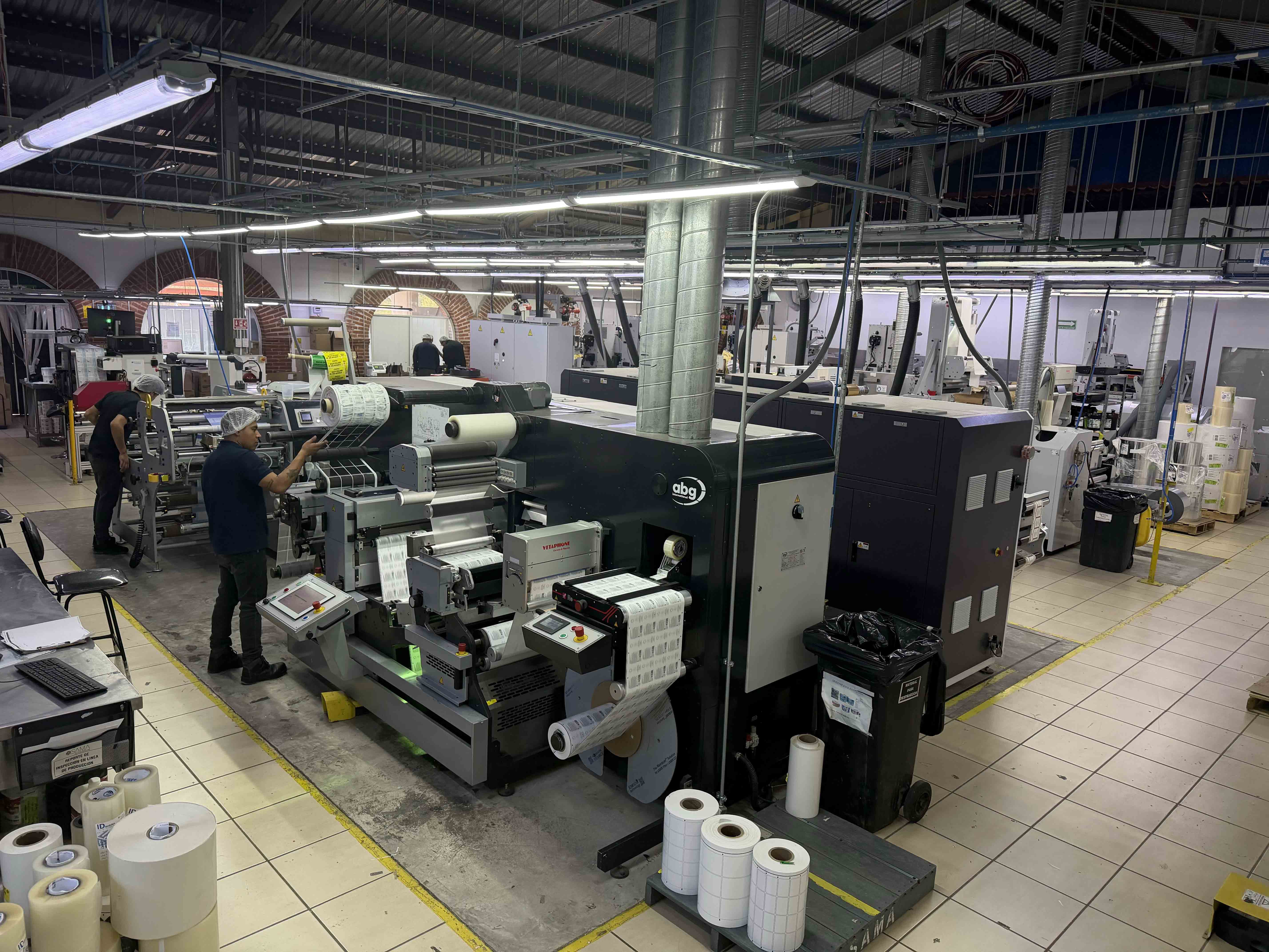 The converter runs shrink sleeve finishing equipment from A B Graphic