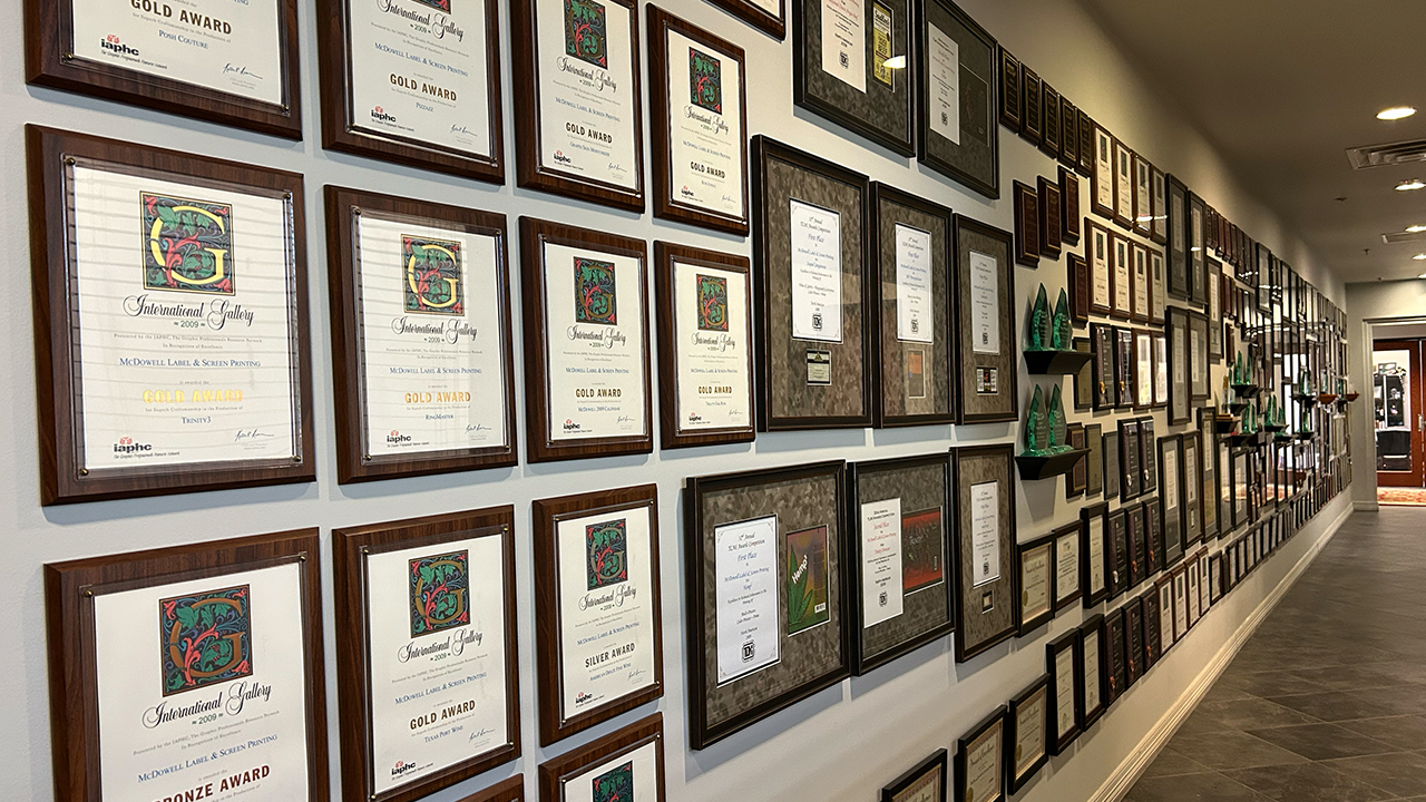 Awards line the walls at the McDowell Label facility in Plano, Texas