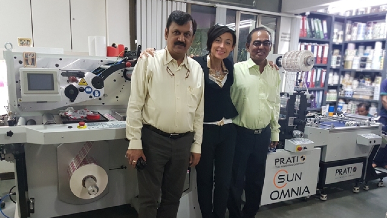 L to R: Neerav Shah, director, Letra Graphix; Chiara Prati, sales and marketing manager at Prati and Sunil Talpade, proprietor of Royal Coat with the new Sun Omnia IML finishing machine installed at Letra Graphix