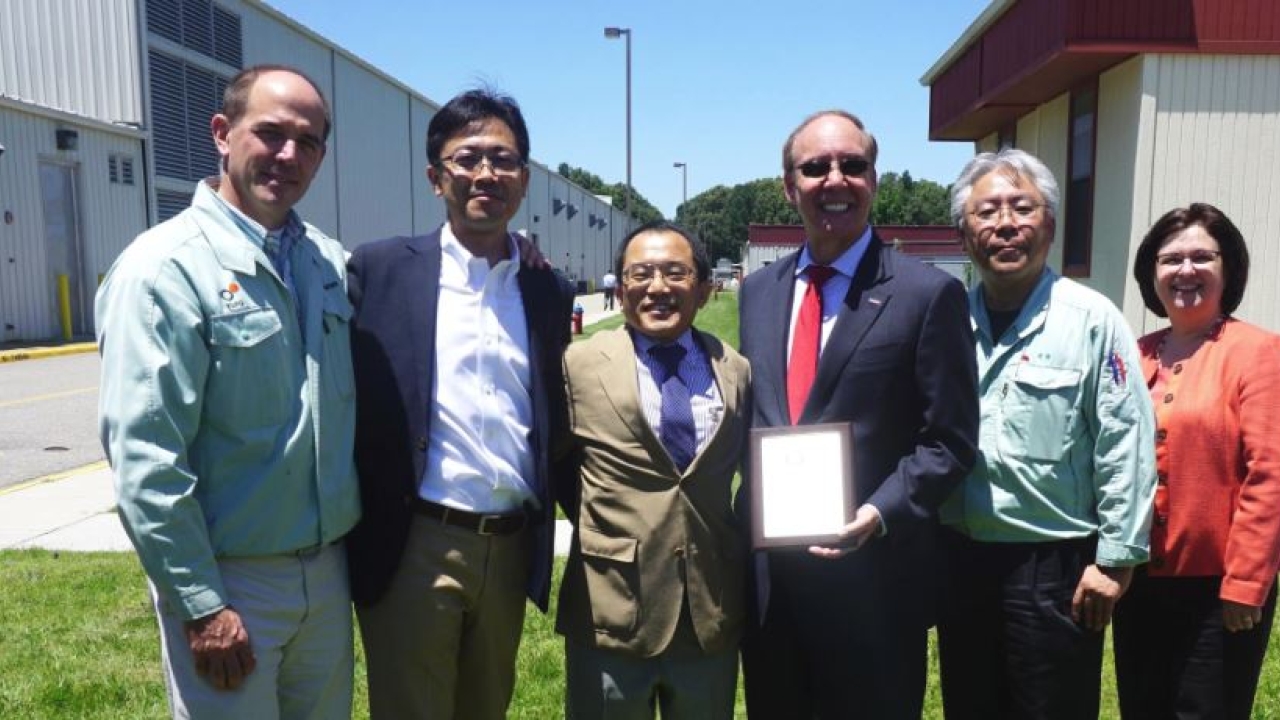 Chesapeake Mayor Alan P. Krasnoff (center) presents the 2016 ‘Chesapeake Business of the Year’ award to the Yupo Corporation America board of directors: Ed Burtner, VP, manufacturing; Takuya Miyaguchi, board member; Masakuni Fukutome, board member; (Mayor Krasnoff); Manabu Watanabe, board member; Karen Zorumski, VP, administration