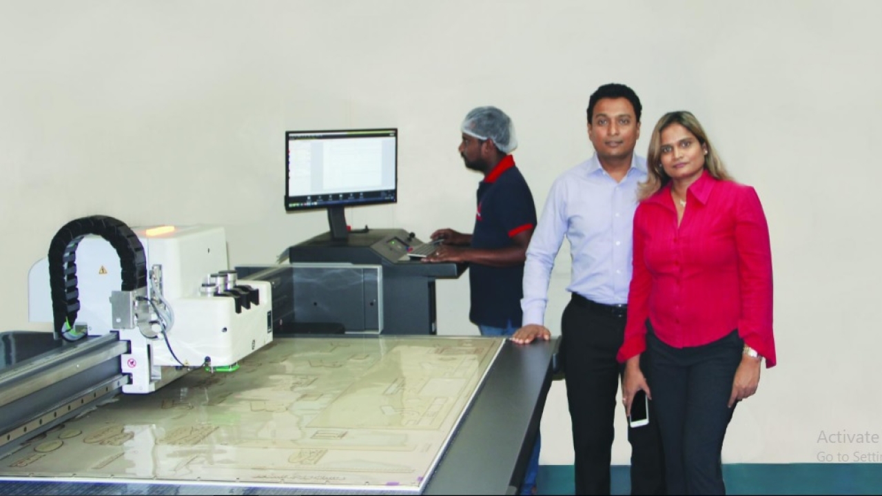 Jai Chandra with his wife at the newly installed Kongsberg X20 cutting table