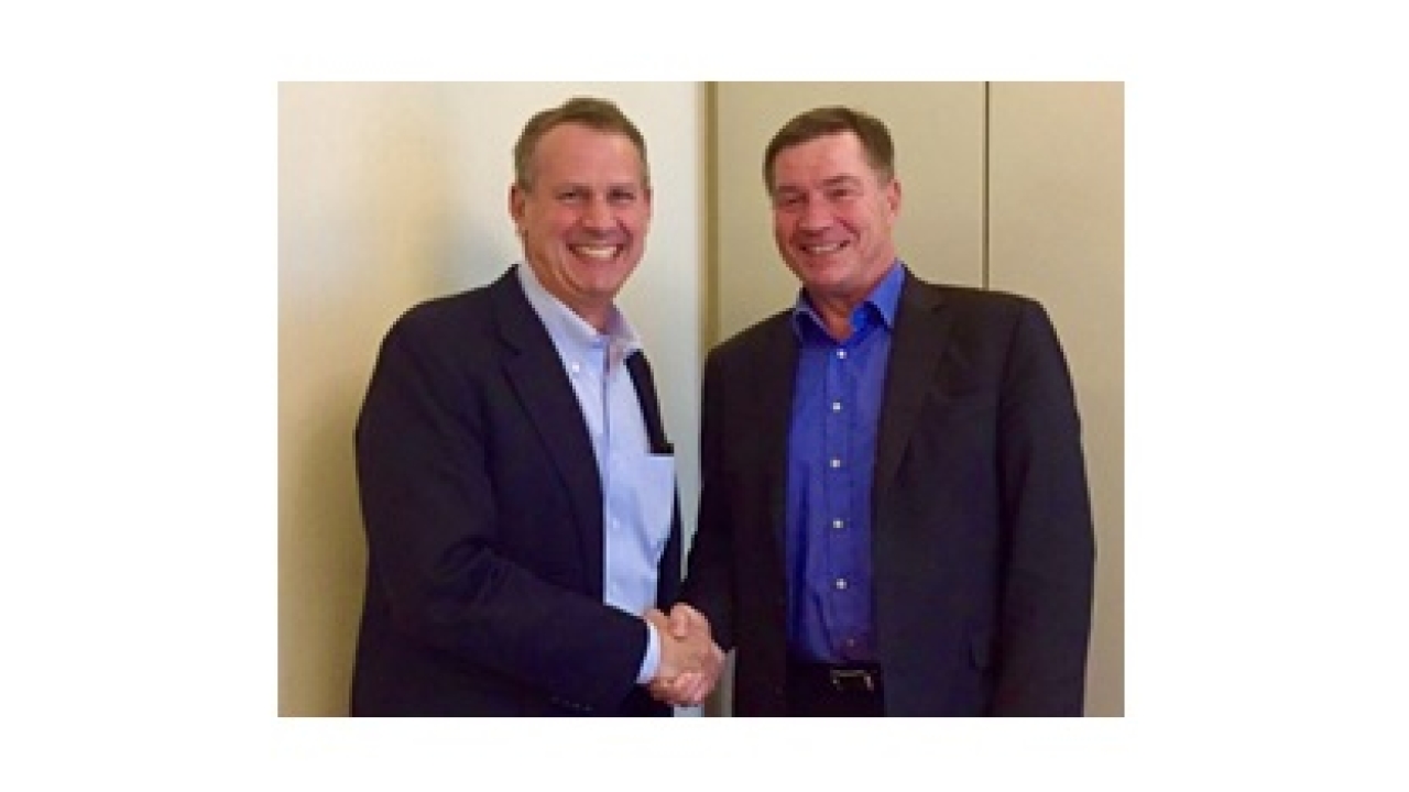 RotoMetrics CEO Bob Spiller (left and Electro Optic CEO Erwin Lindl (right) celebrate the merger