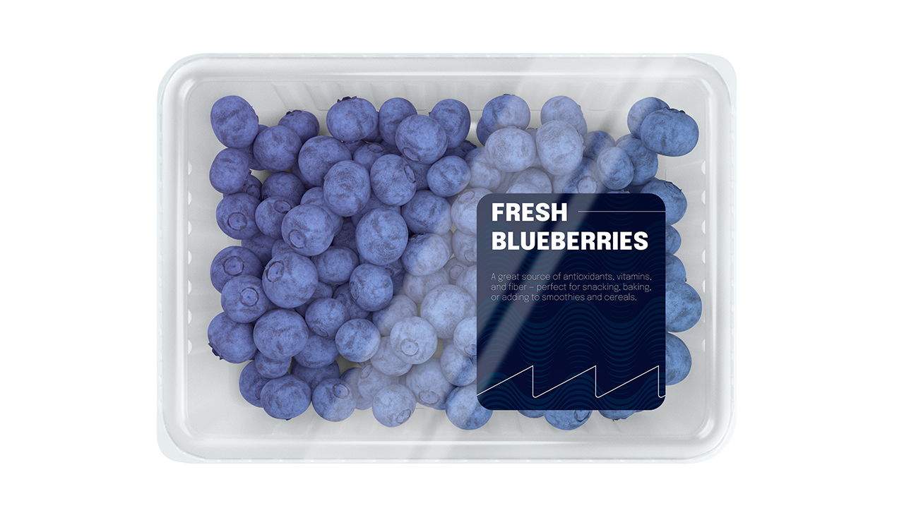 A label reading 'Fresh Blueberries' on a plastic container filled with blueberries