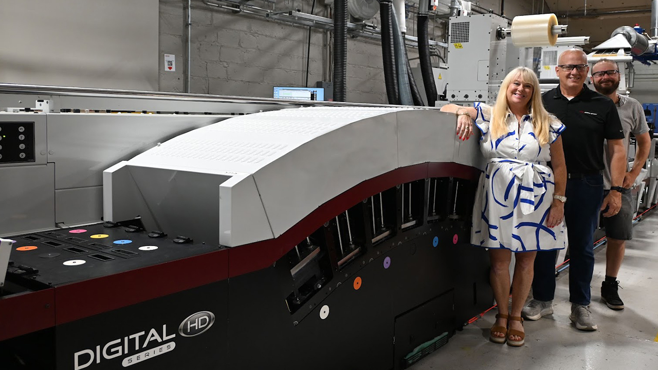 Tara Halpin, Rod Baehner and Robert Reynolds with the Mark Andy hybrid press