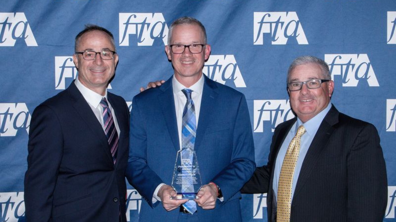 L-R: FTA president Nathan Ridnouer, Garrett Taylor, and Paul Teachout, FTA board chair