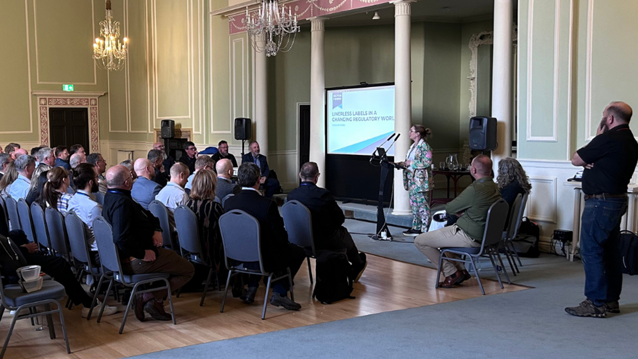 A conference room full of people at Ravenwood Packaging's World Conference