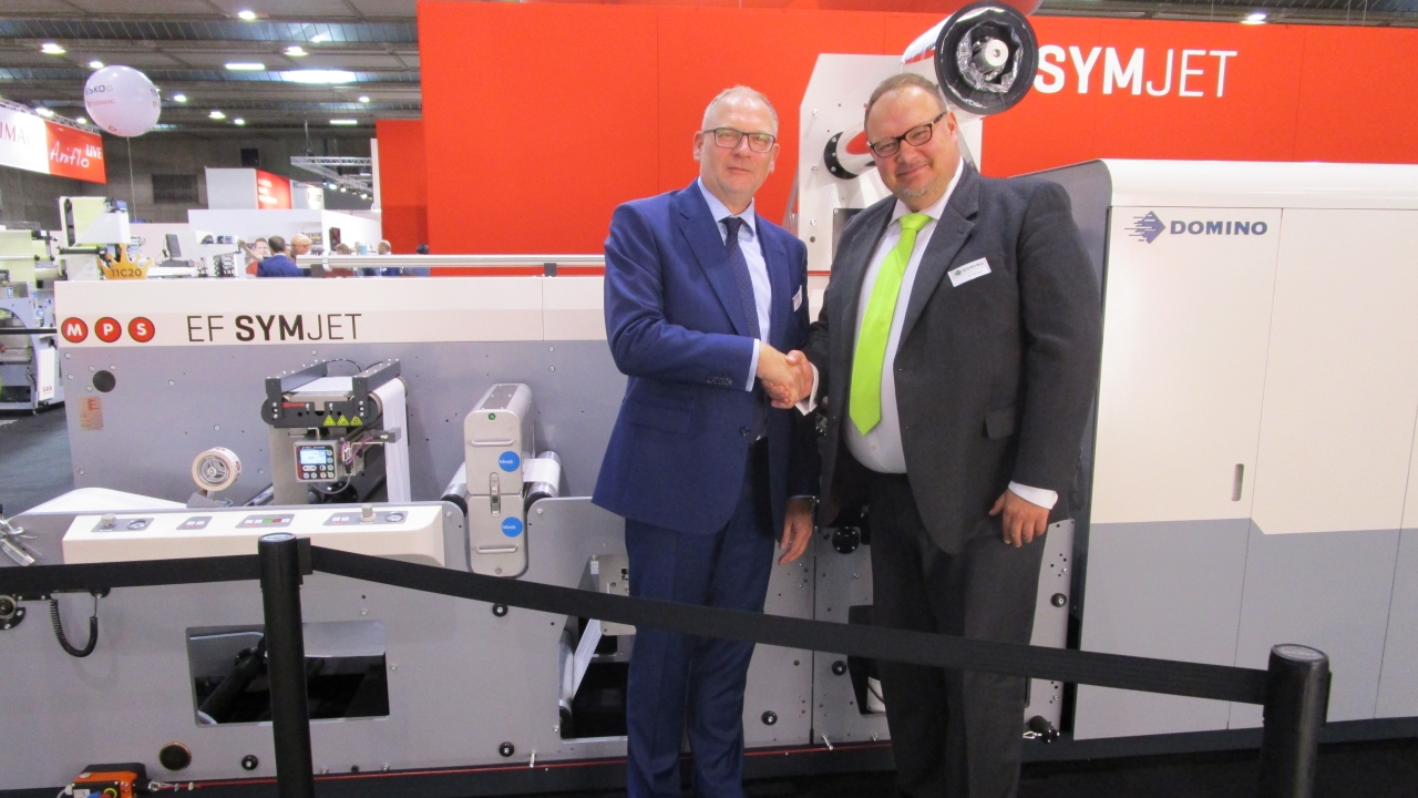 Domino's Vlad Sljapic (R) and MPS'  Bert van den Brink left celebrate partnership with the launch of the new hybrid EF SYMJET Press