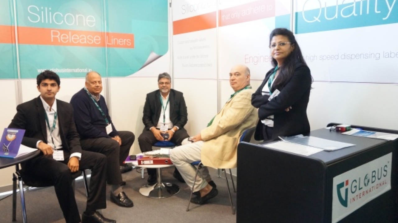 Harsh Doshi, co-director at Globus International (extreme left) with his team and some customers at the company stand at Labelexpo Europe 2015