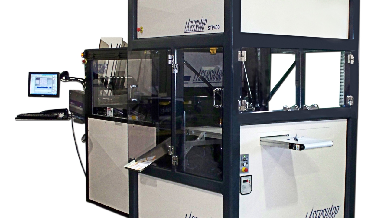 A LasX LaserSharp B2 Motion laser cutter (at rear) inline with a Spider STS-400 