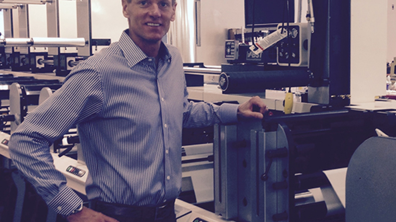 Tom Cummings, president and founder of Primeflex Labels, with the company’s FB-3, its firat Nilpeter press, which was installed in March