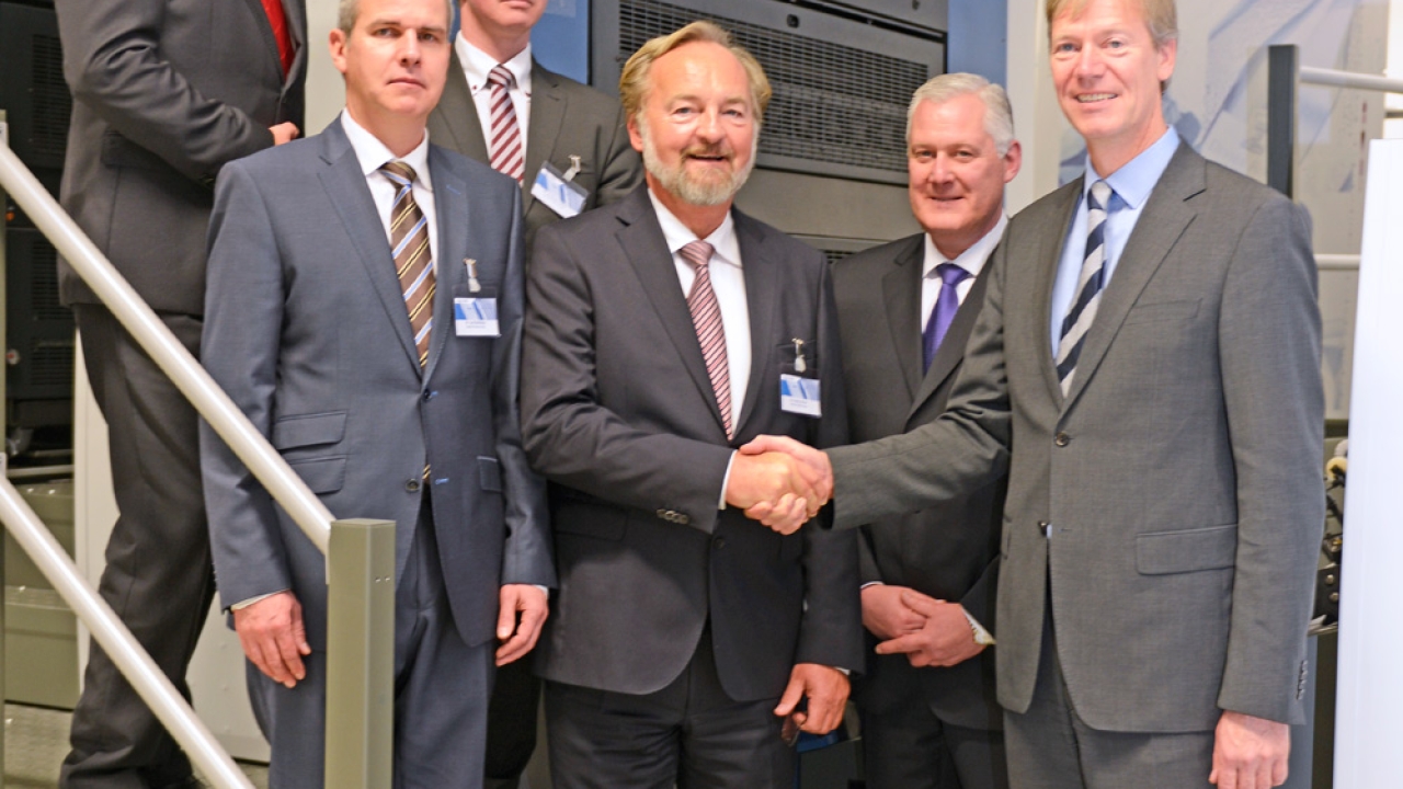Ralf Sammeck (right), KBA executive vice president for the company’s sheet-fed business, shakes hands with Hans Schur, group managing director of Schur International Ralf Sammeck (right), KBA executive vice president for the company’s sheet-fed business, shakes hands with Hans Schur, group managing director of Schur International