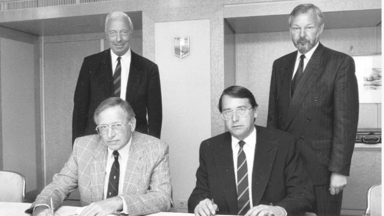 Signing of the first Labelexpo and Finat sponsorship agreement in 1991. At the signing were Harry van Eijk (seated left), Clive Smith (seated right), Mans Lejeune (standing left) and Mike Fairley