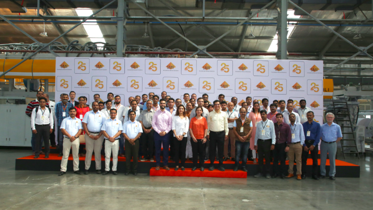The SMI team with clients at the factory tour