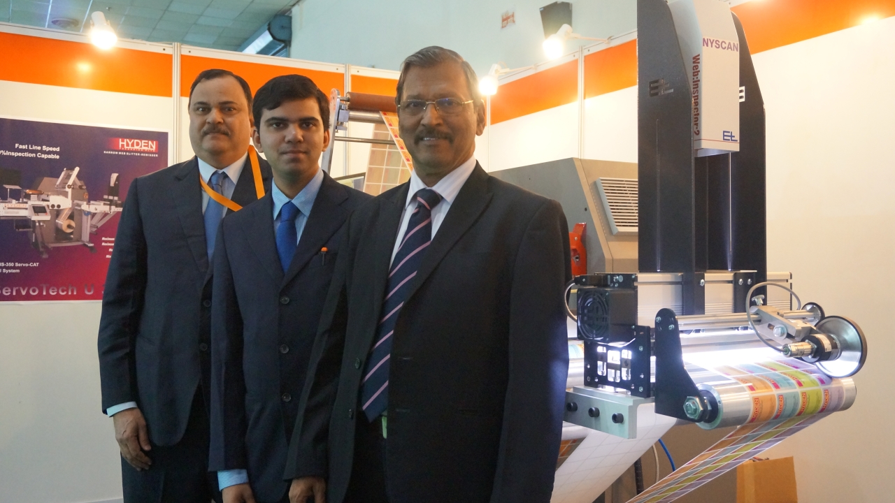 P J Jayakar, managing director, Hyden Packaging and Sudhir Samant, an industry veteran and consultant with the new slitter rewinder at Labelexpo India 2014