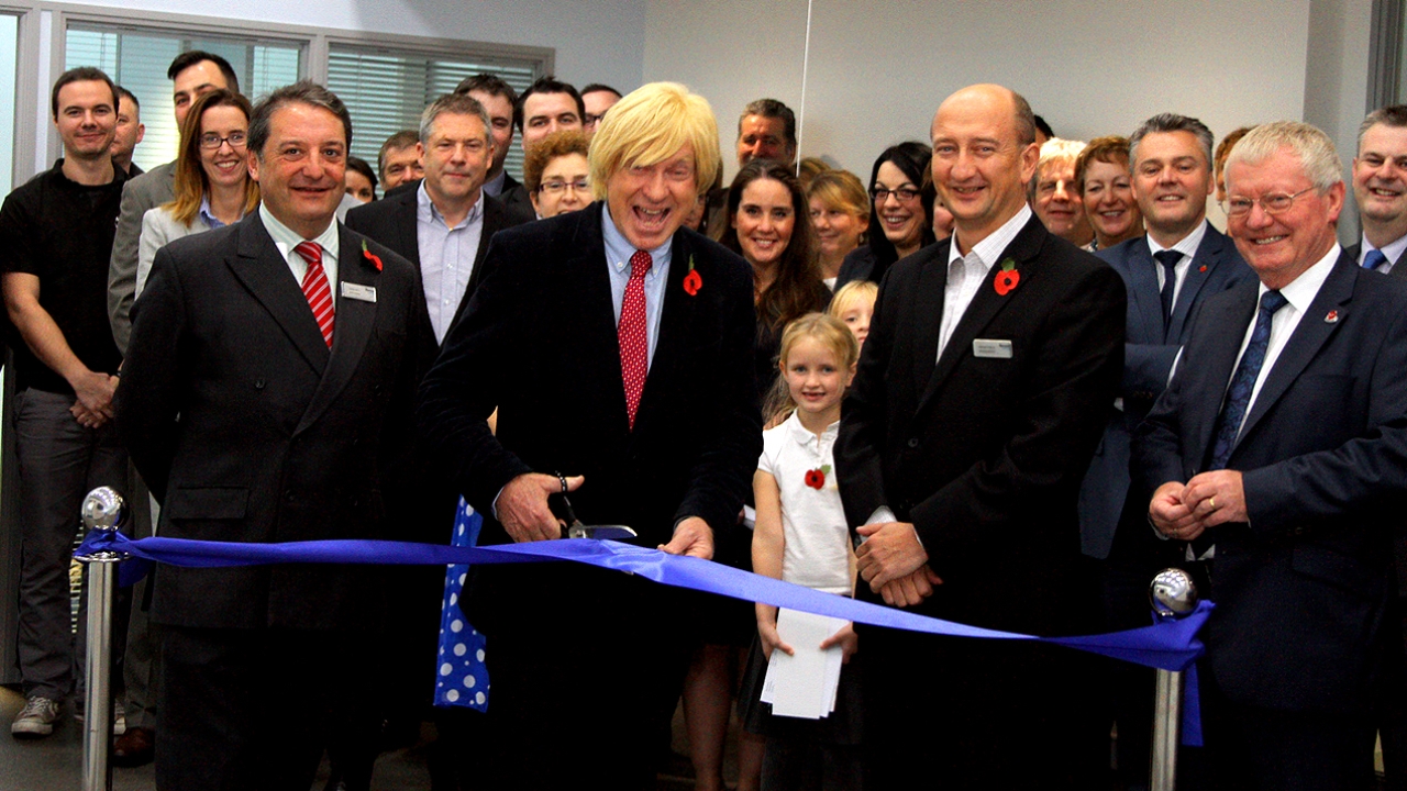 Michael Fabricant, MP for Lichfield cutting the ribbon in the reception of the new factory together with the Directors of Mercian Labels and invited guests: L-R Hugo Gell (Sales Director), Michael Fabricant MP , Adrian Steele (Managing Director), Dennis Marrison (Non-Executive Chairman).  