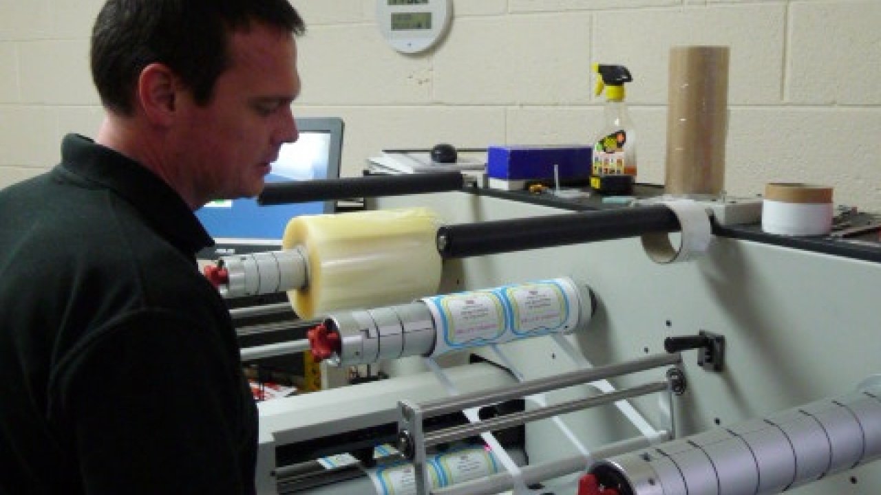 Simon Reade, Malmesbury Labels print manager, laminates, die-less cuts, strips the waste and slits labels printed labels on the Allen Datagraph iTech Centra HS digital label system Simon Reade, Malmesbury Labels print manager, laminates, die-less cuts, strips the waste and slits labels printed labels on the Allen Datagraph iTech Centra HS digital label system