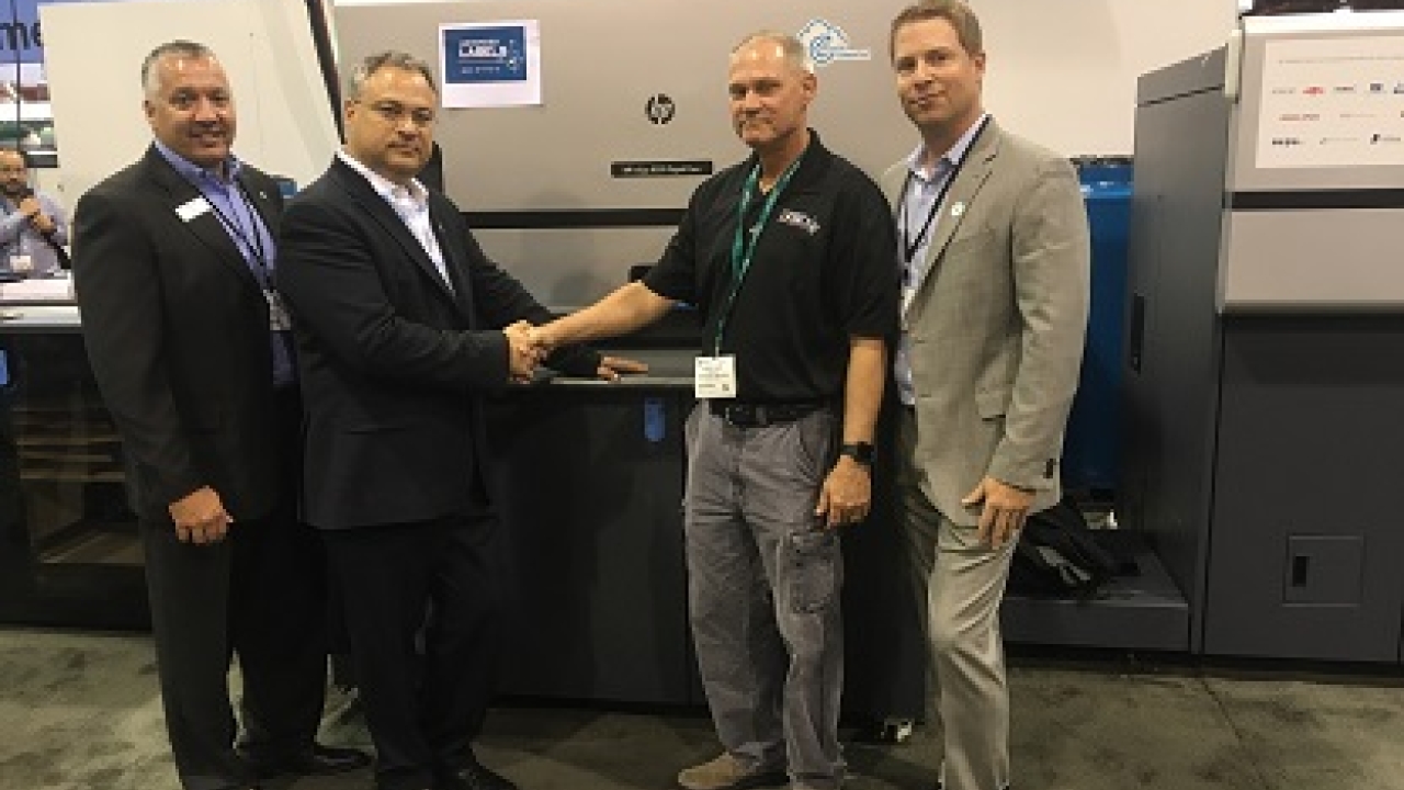 Pictured (from left): Steve Powers and Haim Levit, HP; Kevin Davis, Advanced Labels NW; Zak Callahan, HP Pictured (from left): Steve Powers and Haim Levit, HP; Kevin Davis, Advanced Labels NW; Zak Callahan, HP