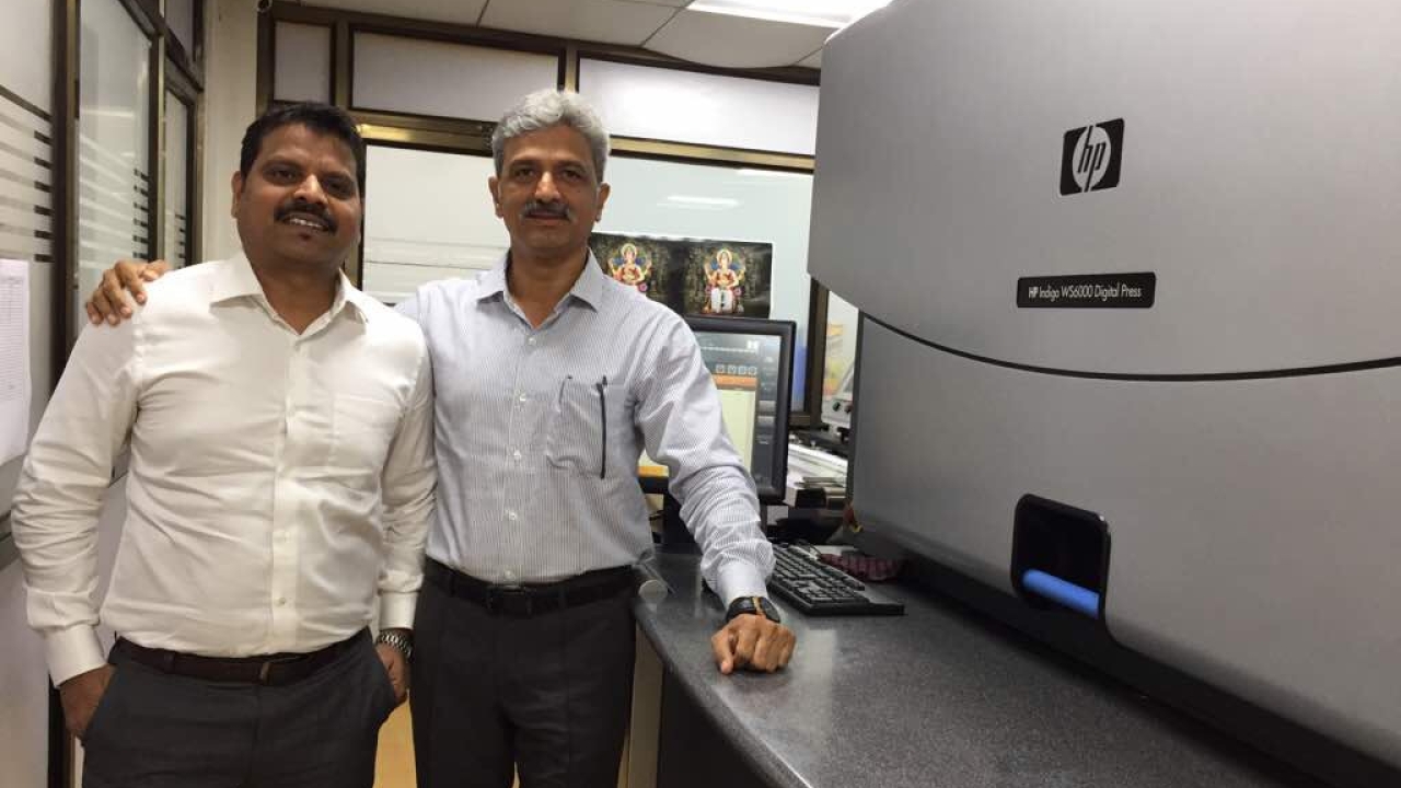 Anil N and Milind Deshpande from Trigon Digital Solutions standing with the newly installed HP Indigo WS6000 digital press