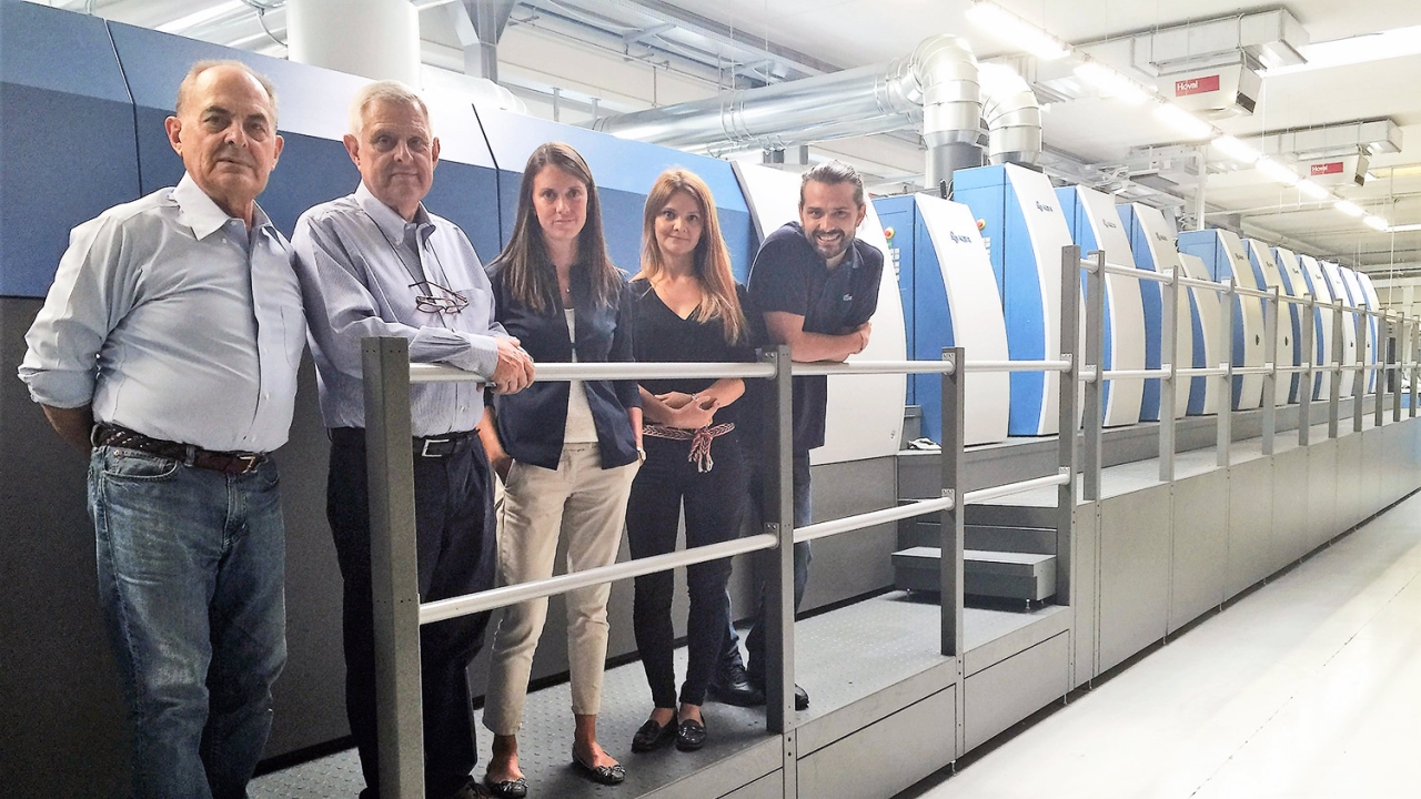 Pictured in front of the new press are Piero, Aldo, Federica, Francesca and Alessandro Gasparini