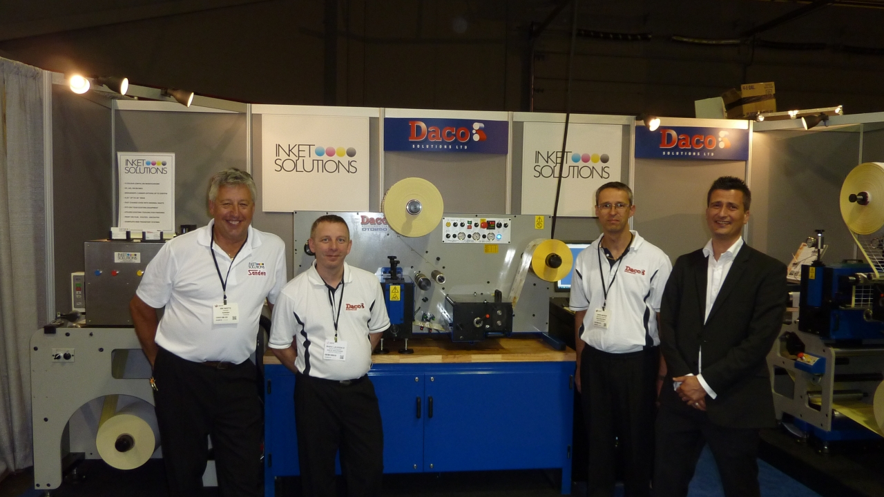 Pictured L-R: Jim Watts, Sanden Machine; Mark Laurence and David Beynon, both of Daco Solutions; and John Richardson, Inkjet Solutions Pictured L-R: Jim Watts, Sanden Machine; Mark Laurence and David Beynon, both of Daco Solutions; and John Richardson, Inkjet Solutions