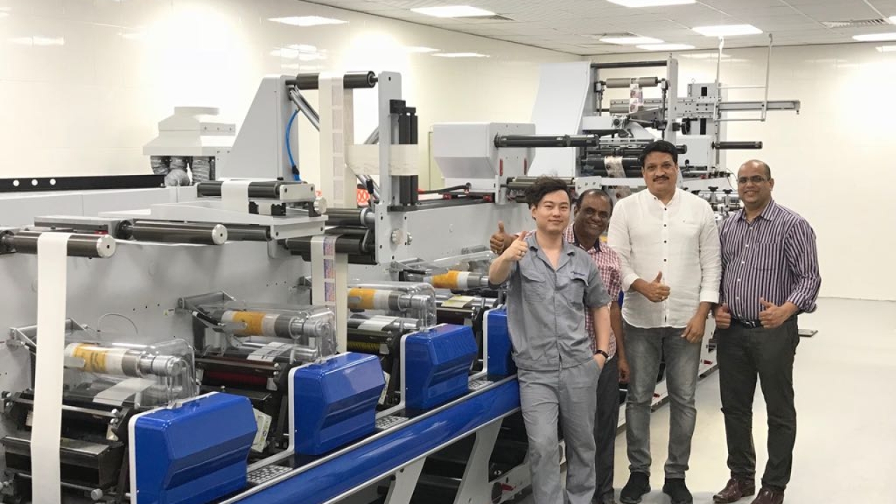 Solanki (third from left) and the team with the newly installed Weigang press at Sicon Pack plant in Nigeria