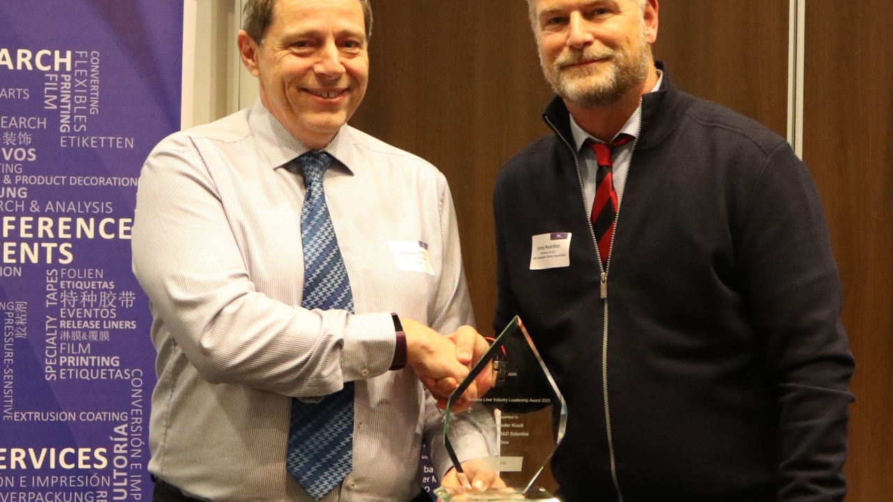Alex Knott of Dow Corning (left), receives the AWA Release Liner Industry Leadership Award from AWA’s Corey Reardon