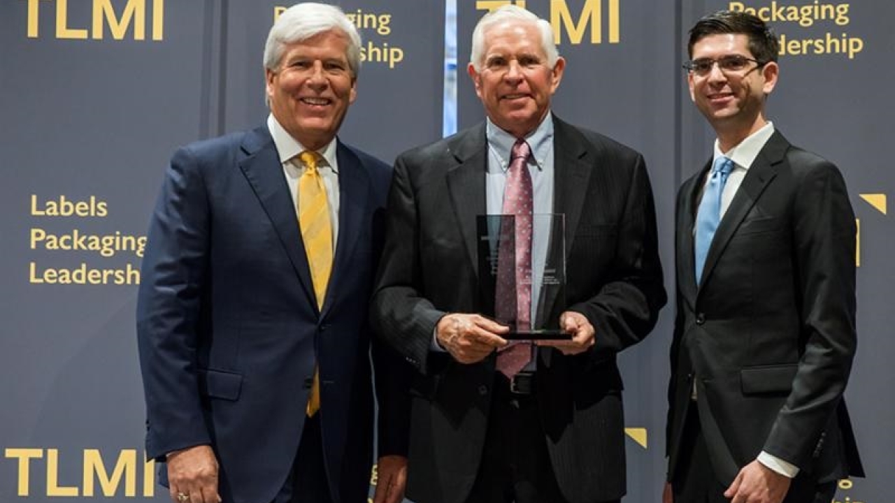 Craig Moreland, TLMI Chairman, Joel Carmany, President of Consolidated Label, and Cory Francer, packagePRINTING magazine. Joel Carmany named TLMI Converter of the Year
