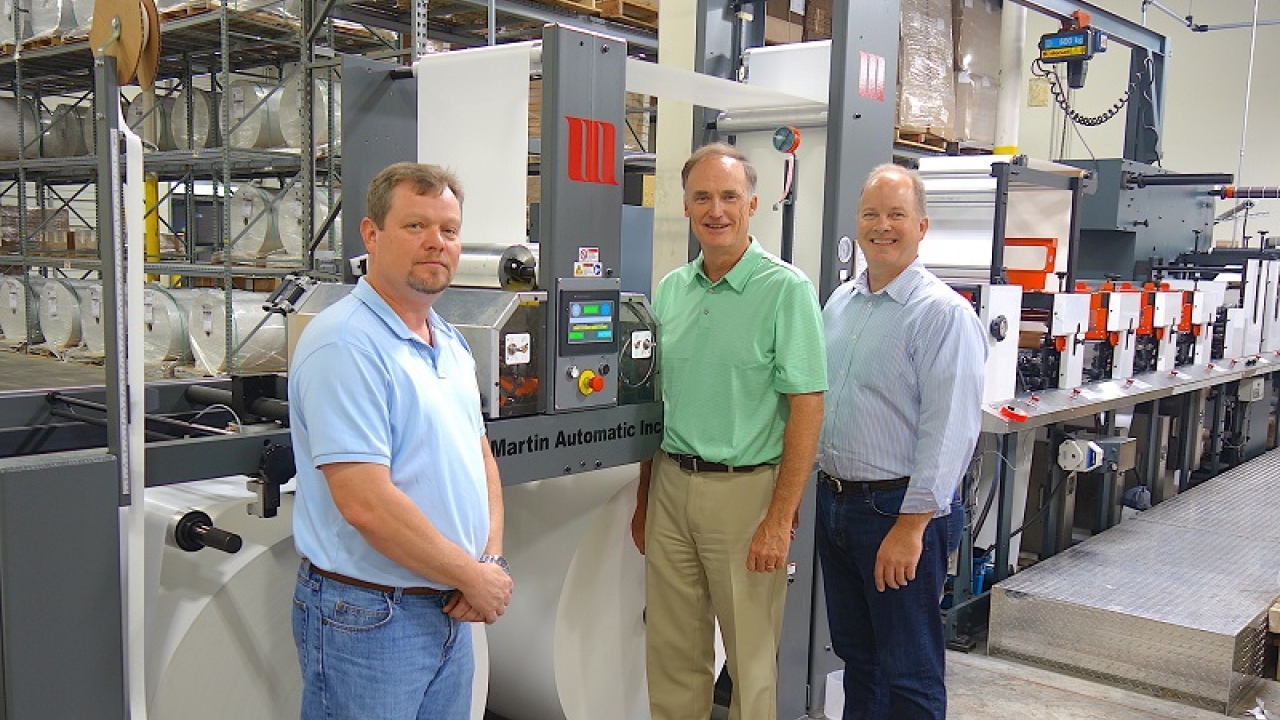 Pictured (from left): Shane Martin with Greg Bishop and Steve Hangartner and the Martin Automatic MBS fitted to Kinetic’s 16in Gonderflex press Kinetic Label Services moves forward with Martin Automatic butt splicer