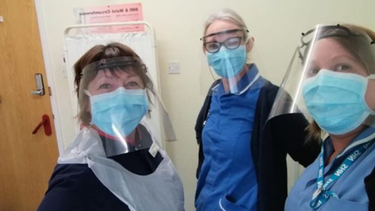 NHS staff at Chesterfield Surgery wearing face shields produced by Rollem