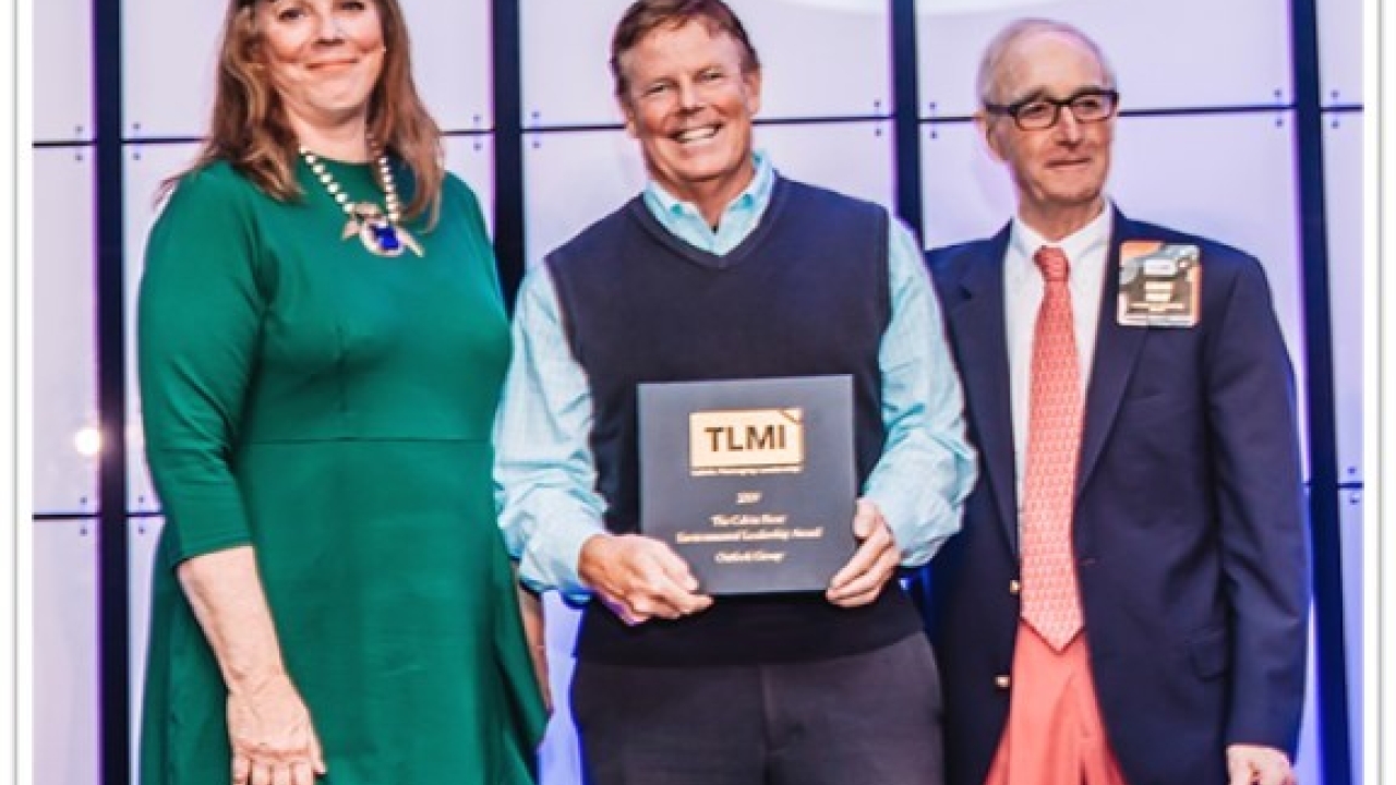 Rosalyn Bandy, Kevin Hayes, President, Outlook Group, and Calvin Frost Outlook Group recieves environmental award