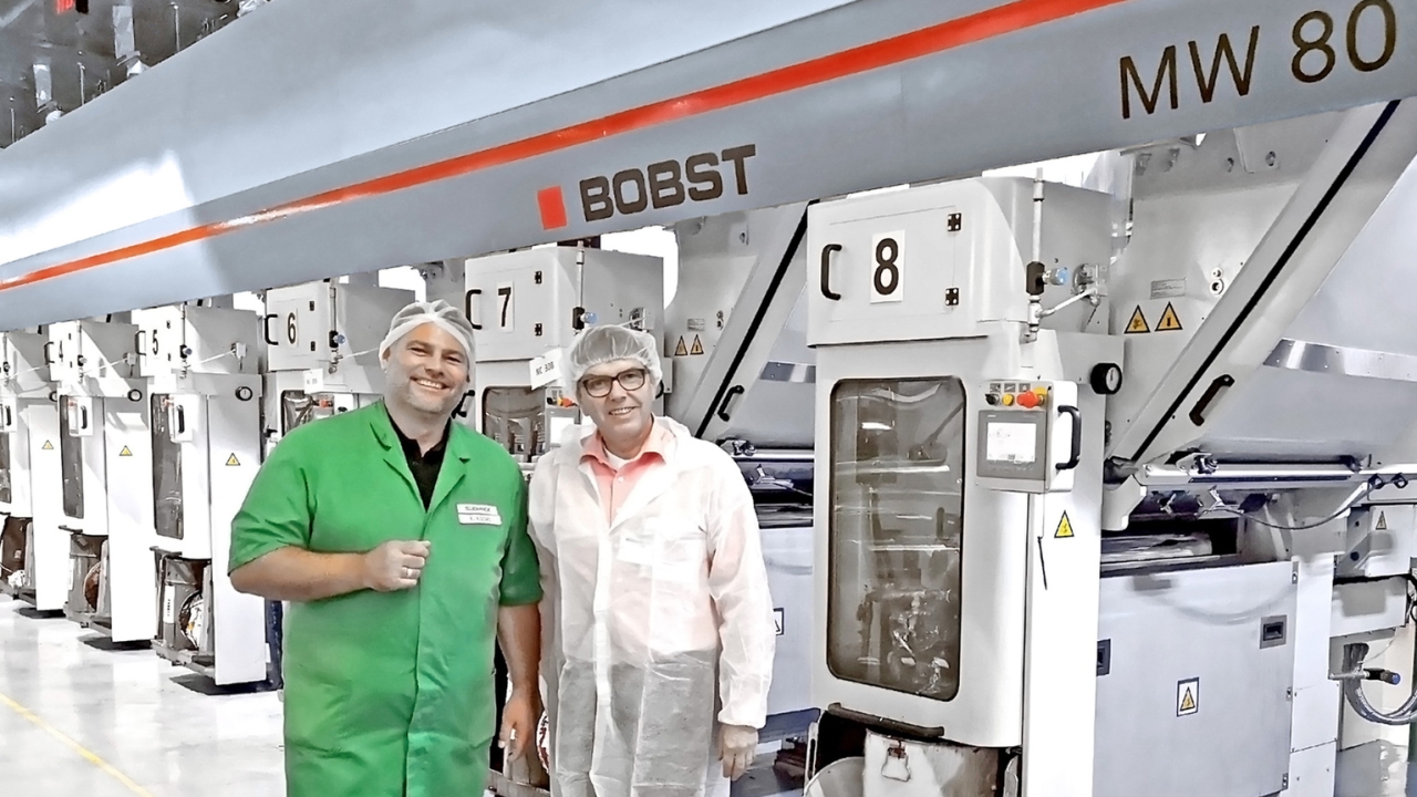 Enrico Riesel (left), Südpack Bioggio managing director, and Thomas Reckert, zone business director, Bobst web-fed business unit, in front of the MW 80 gravure printing press in Südpack Bioggio’s production plant in Bioggio, Switzerland Dedicated gravure press proving its worth for short runs of packaging