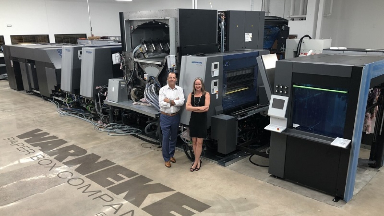 Steve Huppert (left) and Stacy Warneke (right) with the company's new Heidelberg Primefire 106