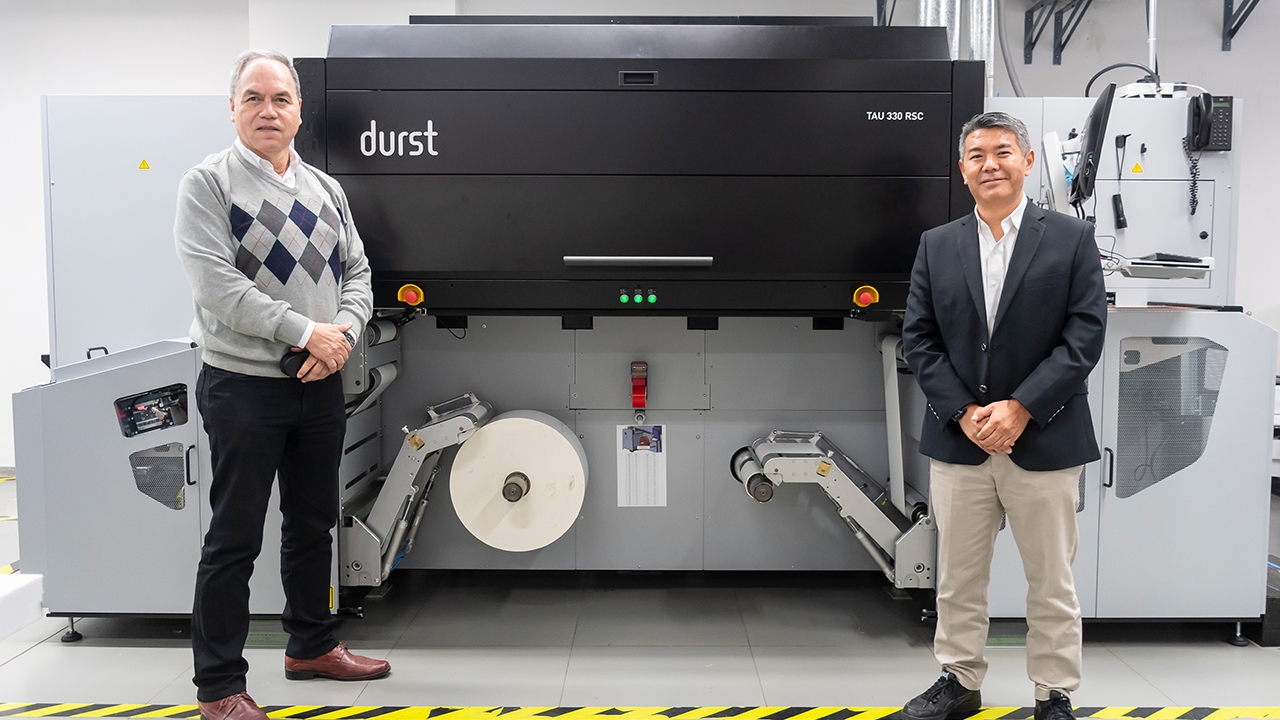 L-R: Fernando Montedoro, sales manager, and JaimeYoshiyama, CEO, with the new Durst Tau RSC inkjet press – the first in Peru