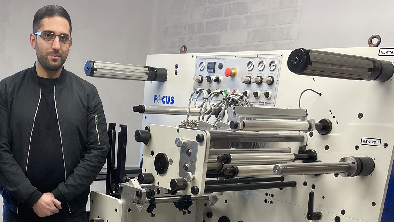 Isaan Farooq, managing director of Labels Fast, in front of newly installed Focus Label Machinery FS 330 Series