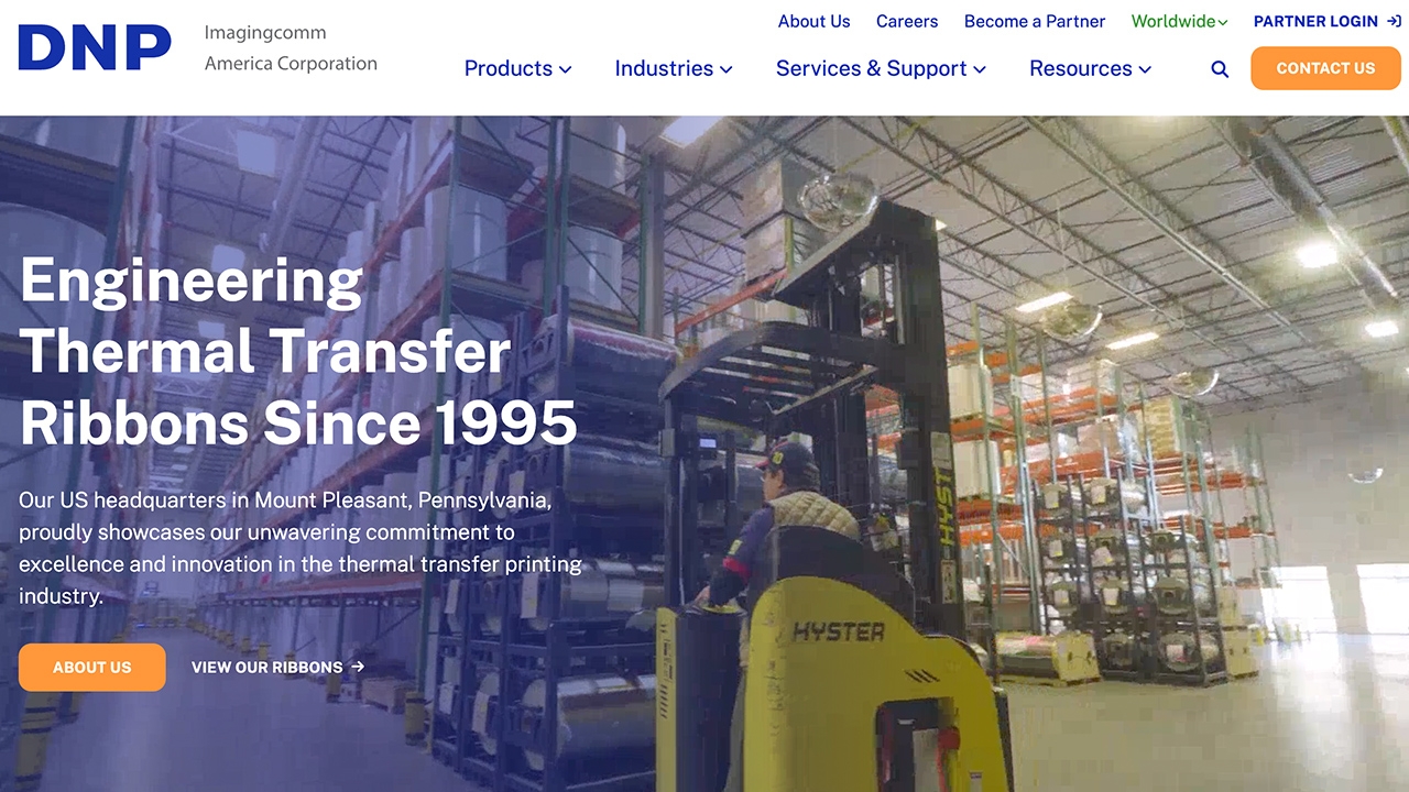 DNPribbons.com homepage features navigation bar at the top and big text reading "Engineering Thermal Transfer Ribbons Since 1995" over image of factory floor