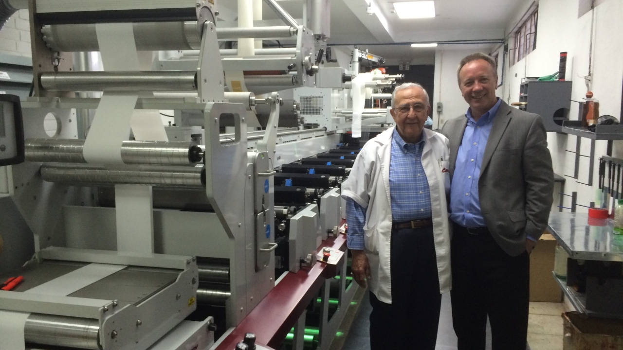 Carlos Mancheno (left), owner of Carlex Cia and Cavey in front of the new Mark Andy Performance Series P5
