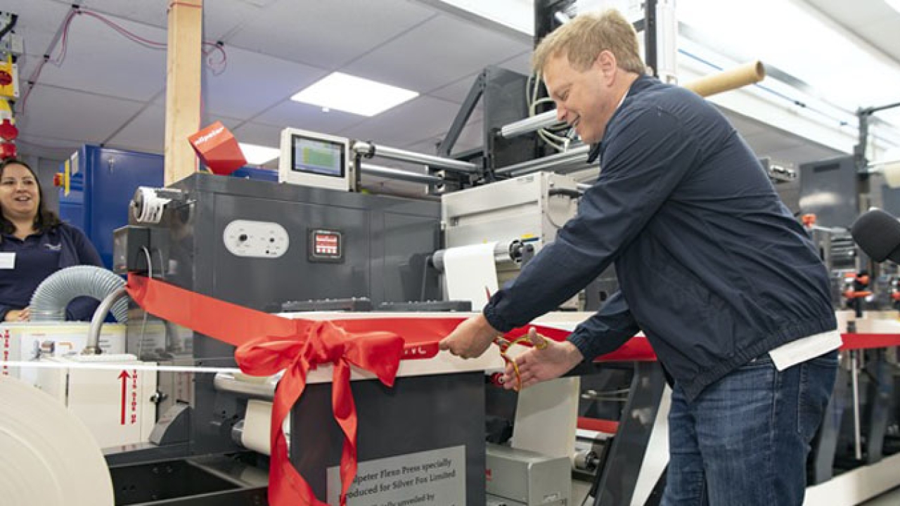 UK secretary of State for Transport, the Rt Hon Grant Shapps MP, cuts the ribbon on Silver Fox’s new Nilpeter FB-350, at an event on the June 24, 2022.