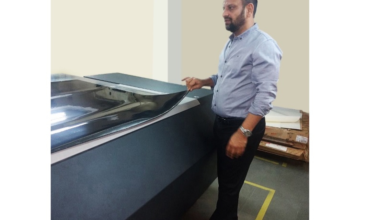 Creative Graphics and Tanushii owner Deepanshu Goel demonstrates the new Esko CDI Spark 4260 installed at Tanushii in Chennai
