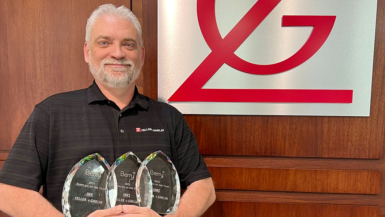 Tim Smith holds awards