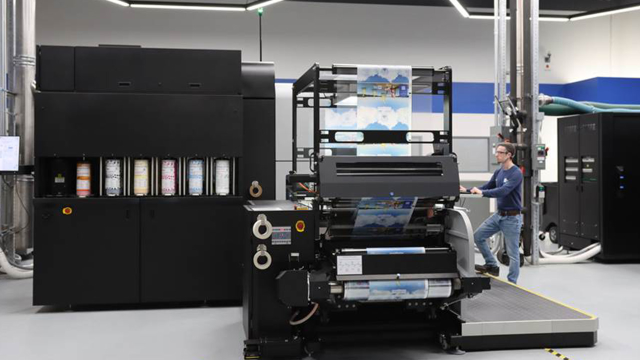 A man works at the screen of the new digital unit