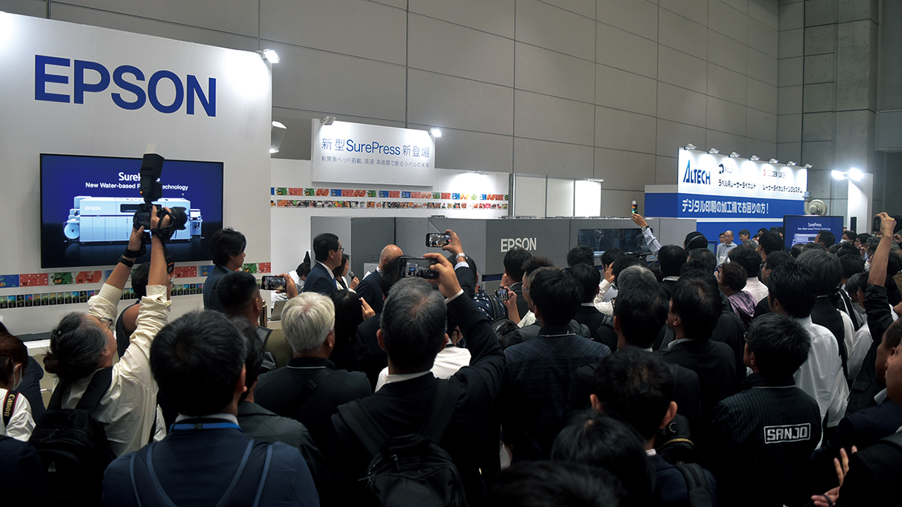 A crowd at the Epson booth