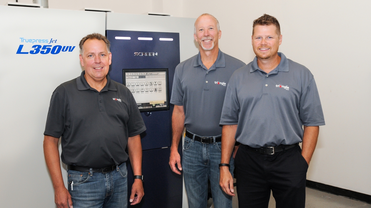 Pictured (from left): Triangle Label staff Scott Kneer, operations manager; Tom Hagedorn, plant manager; Jaime Balent, director of sales