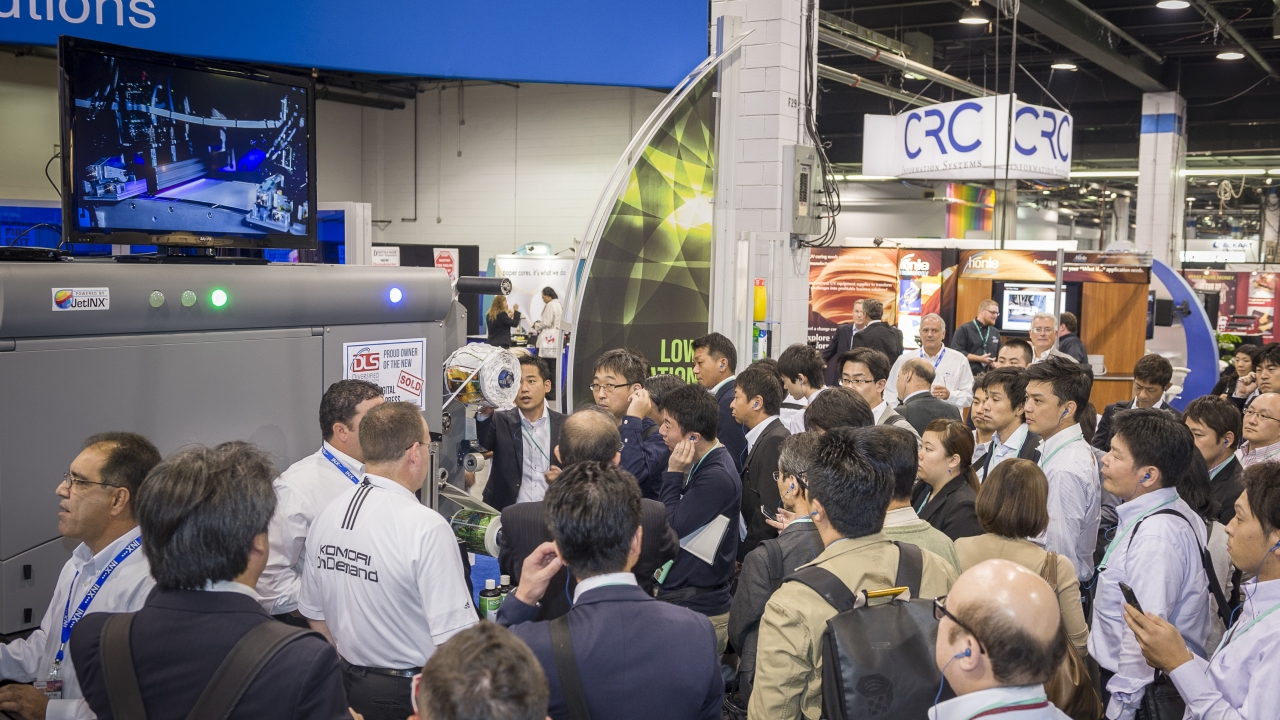 A foreign delegation receives a technology briefing on-stand during Labelexpo Americas 2014